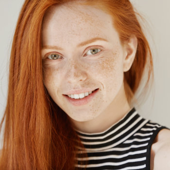 Gentle redhead girl smiling Duluth Dental Studio patient