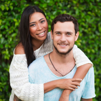 Young couple smiling Duluth Dental Studio dental care visit